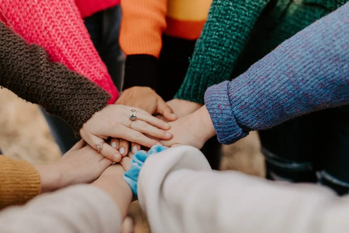 Diverse hands together in support and community